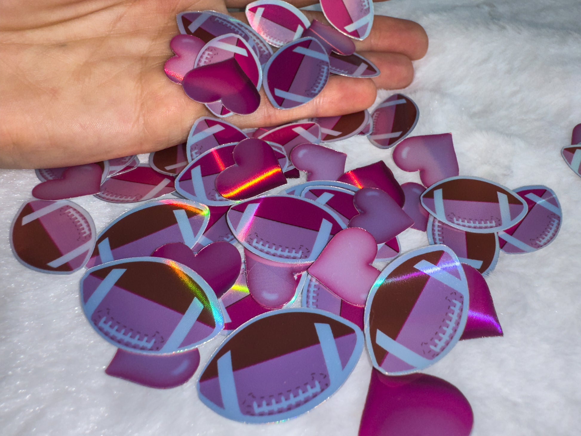 Holographic footballs and heart stickers