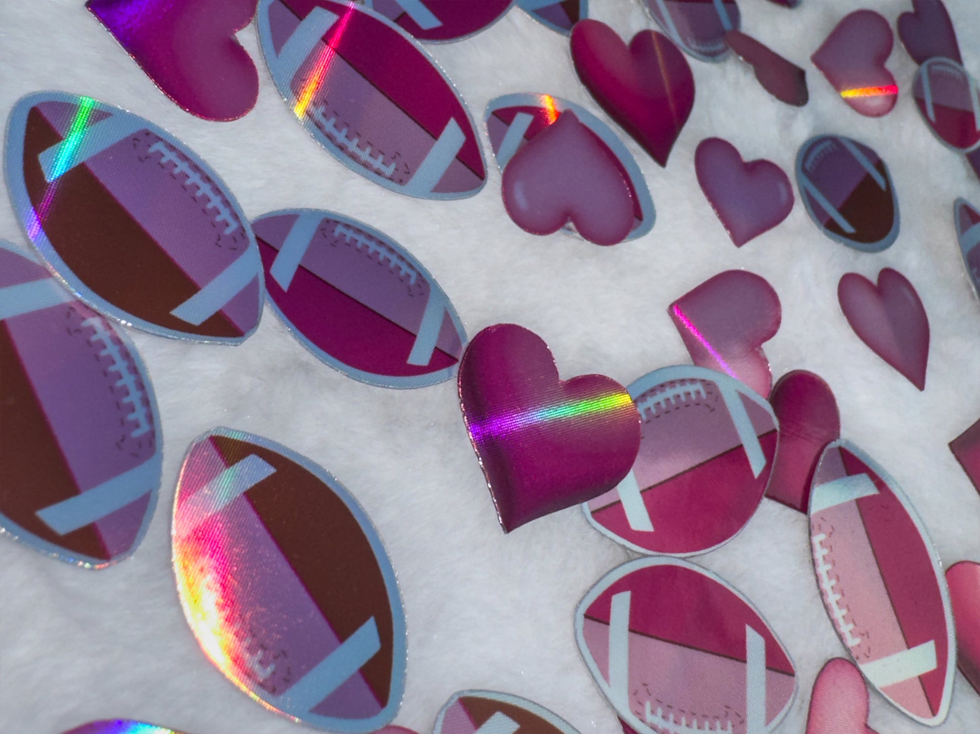 Holographic footballs and hearts stickers